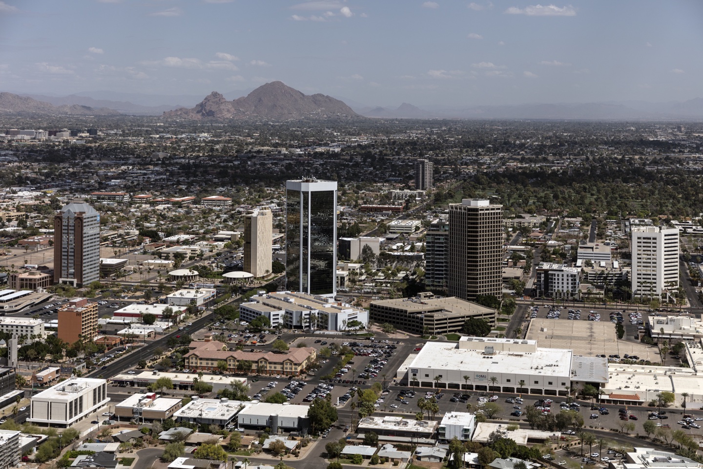 Aerial view of downtown Phoenix, Arizona. Although Phoenix is (as of 2019) the sixth-largest city in the United States, it lacks the packed centralized core of skyscrapers found in many other large U.S. cities. Instead there are pockets of tall buildings, mainly along the north-south Central Avenue corridor