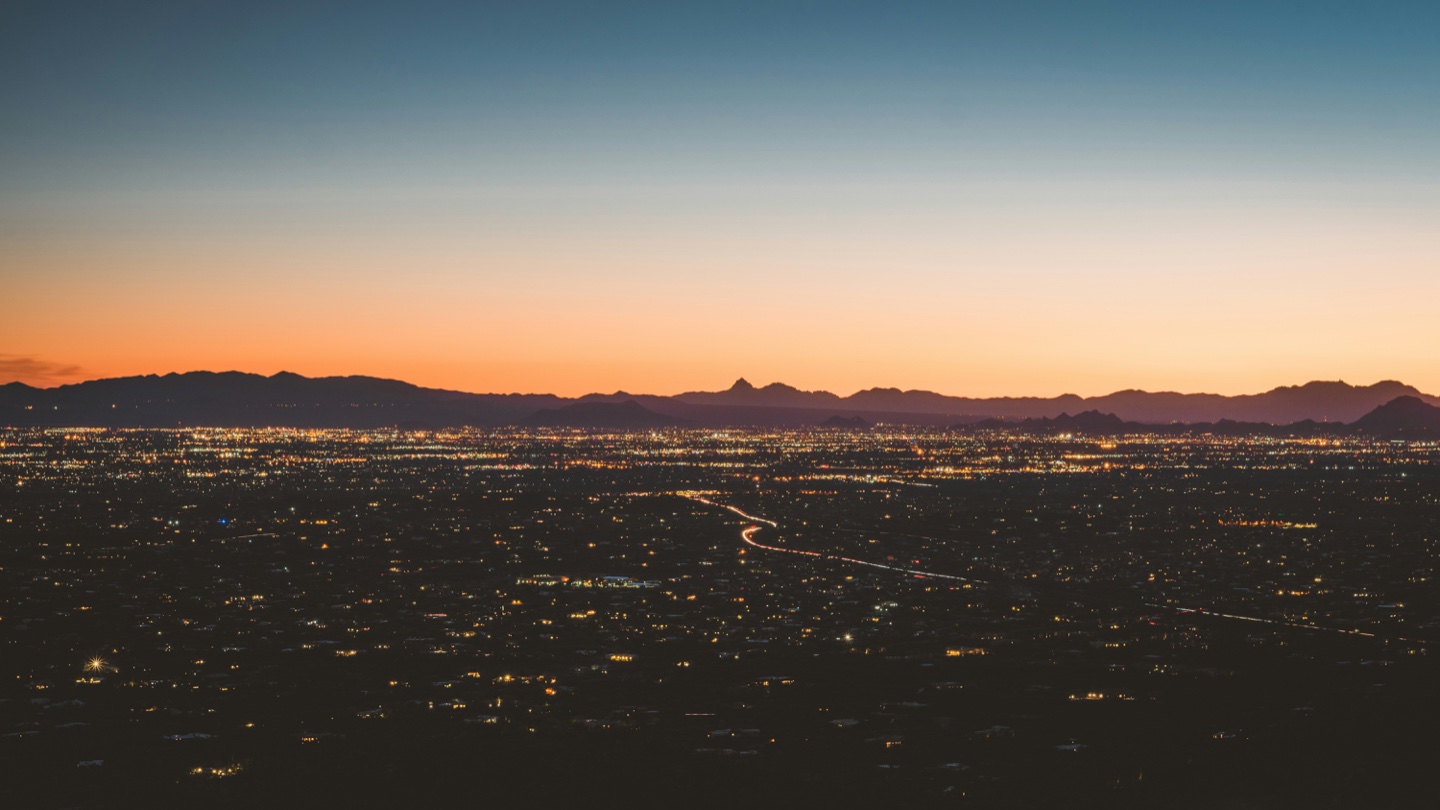 Tucson city lights and mountains at sunset